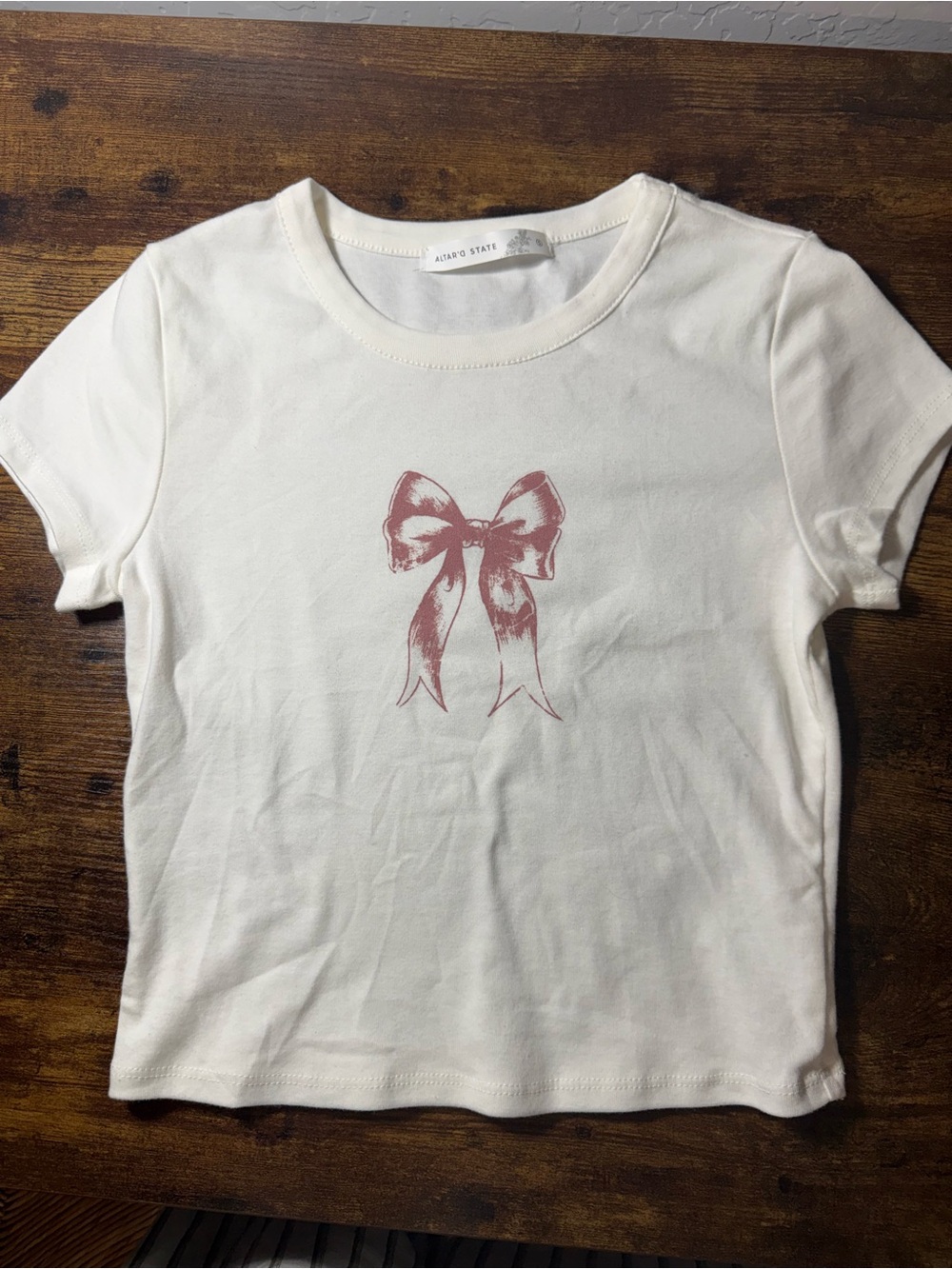LIKE NEW. Altard State' Cream Tee with Pink Bow Graphic. S.